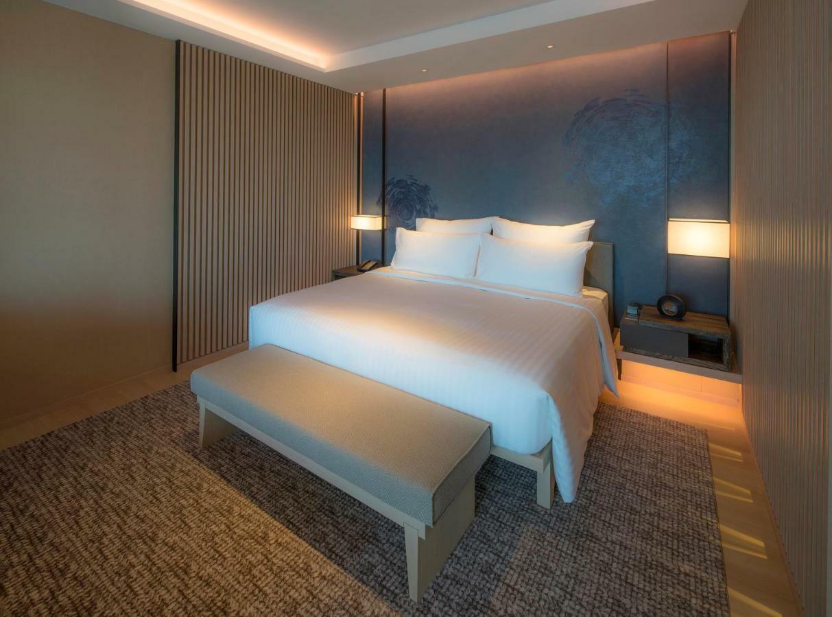 Mu Jiaoxi Hotel Buitenkant foto A bedroom at the hotel